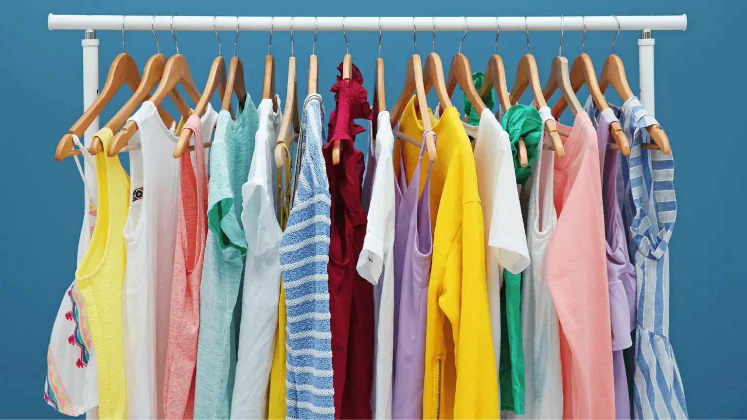 Created in Canva Clothes hanging on a rack