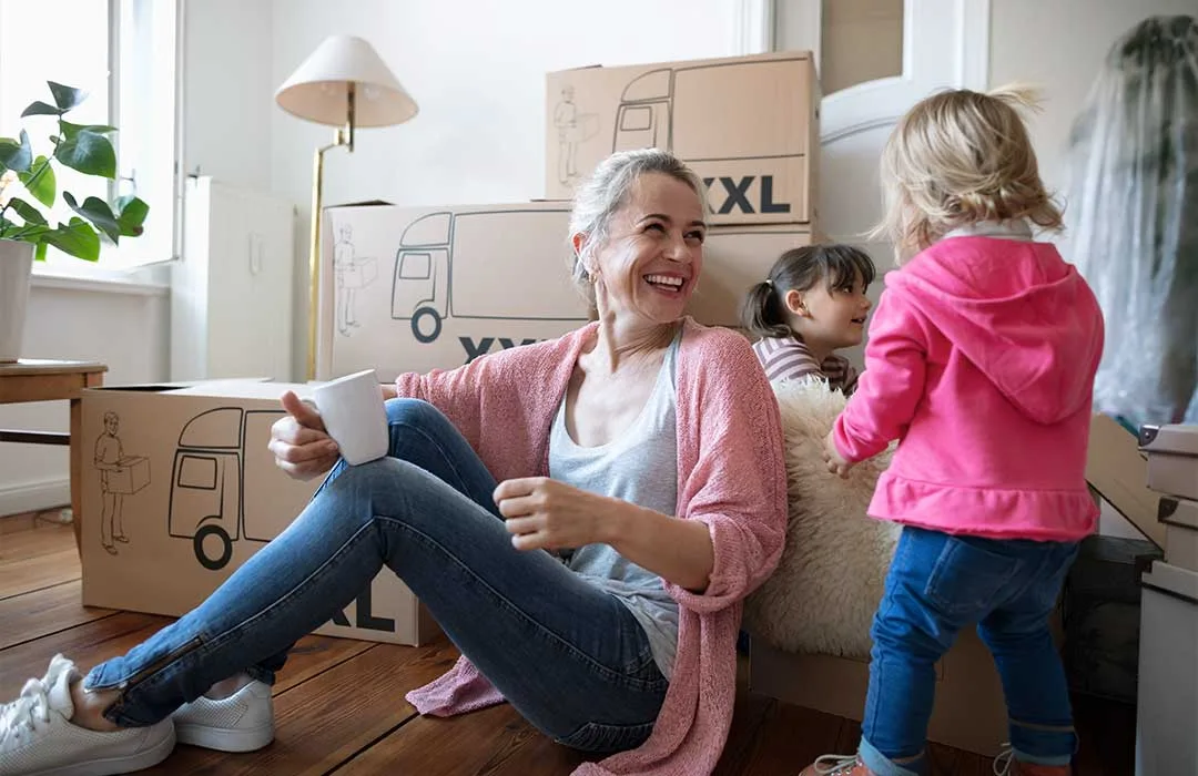Image: Getty Images Happy family moving into new house