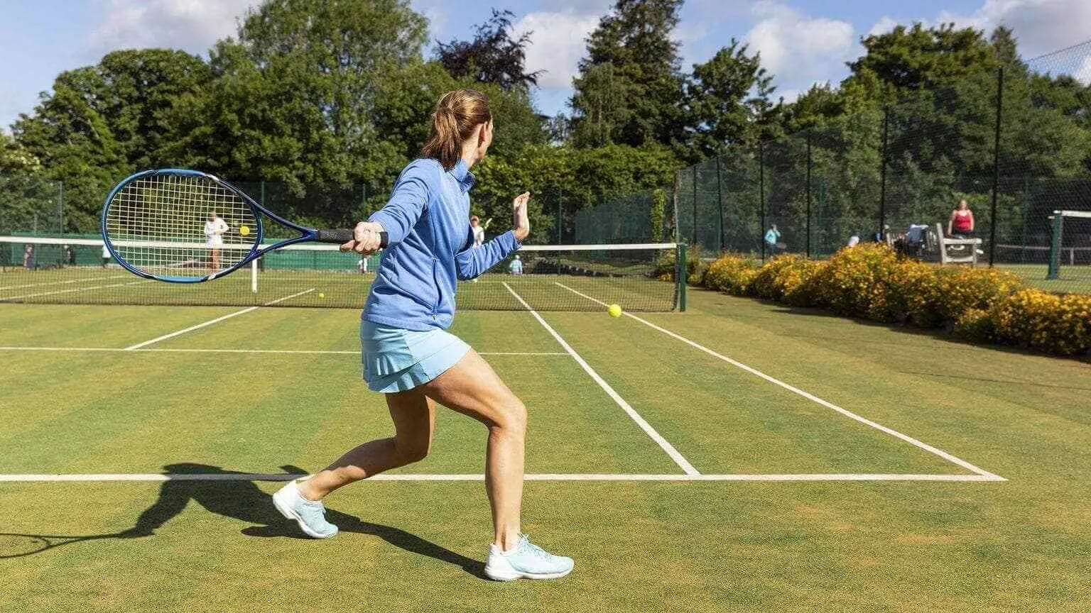Image: Getty Images Woman during a tennis match on grass court