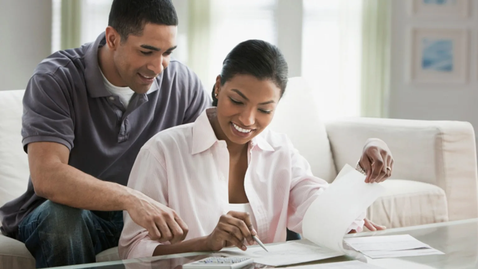 Image: Getty Images A couple calculating bills