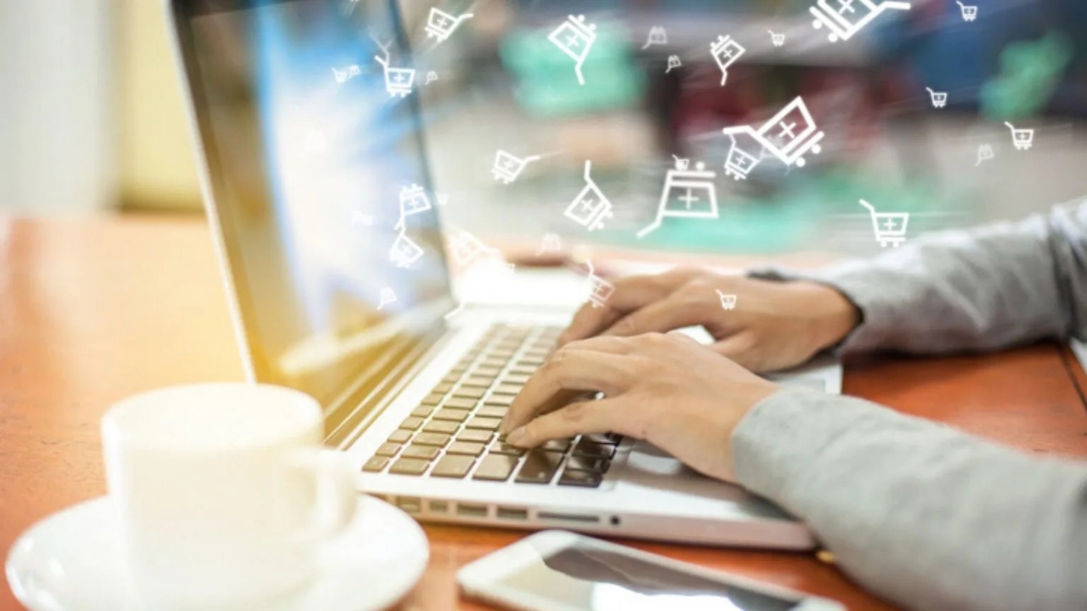 Image: Getty Images Man using his laptop for online shopping
