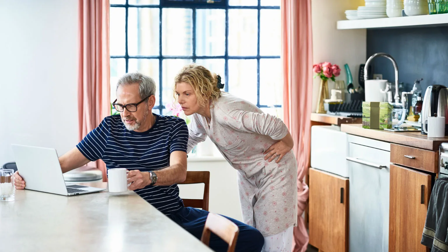 Image: Getty Images Couple reviewing finances.