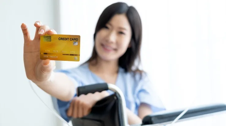 Image: Getty Images A patient with a credit card in hand