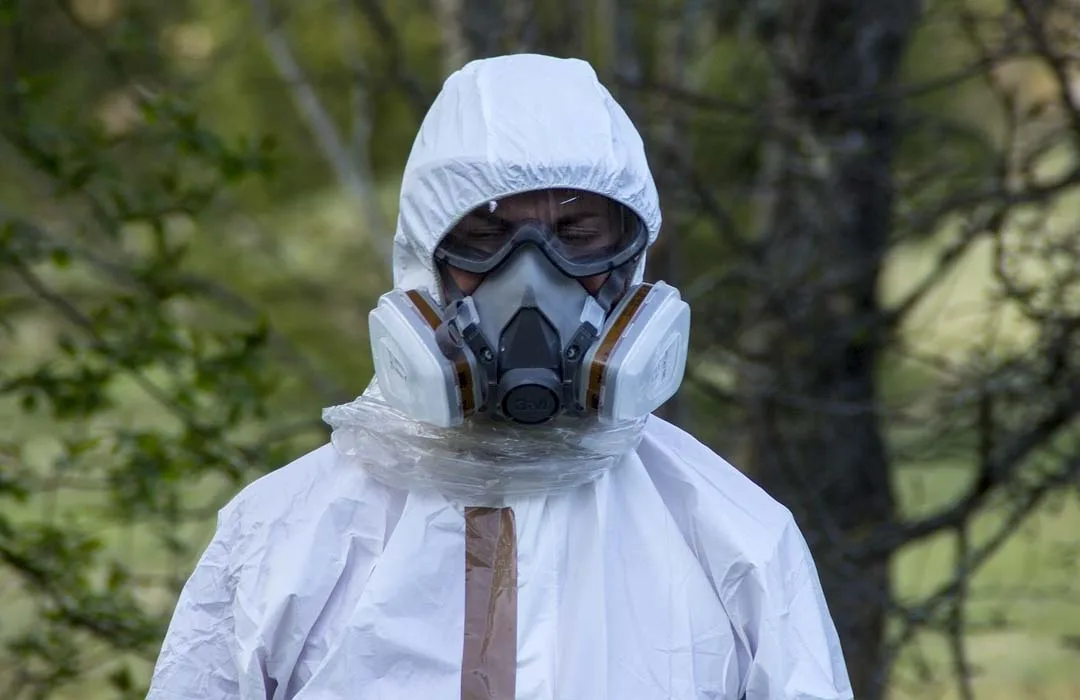 Image: Getty Images Person using white protection suit