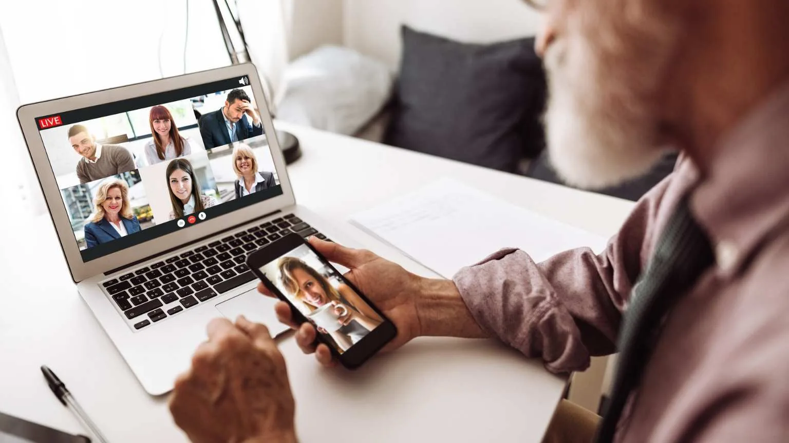Image: Getty Images Bearded guy making a business video conference
