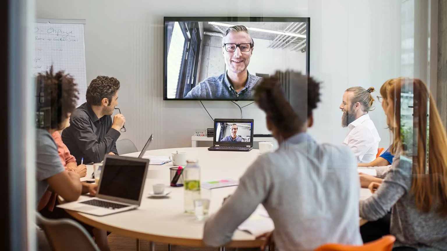 Image: Getty Images Business people having video conference meeting in board room