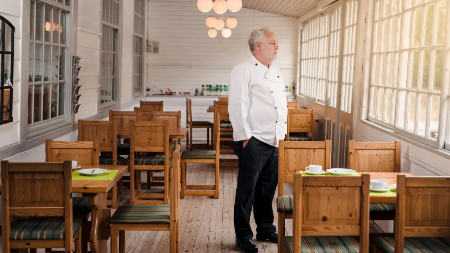 Image: Getty Images Man standing in his empty business during coronavirus pandemic