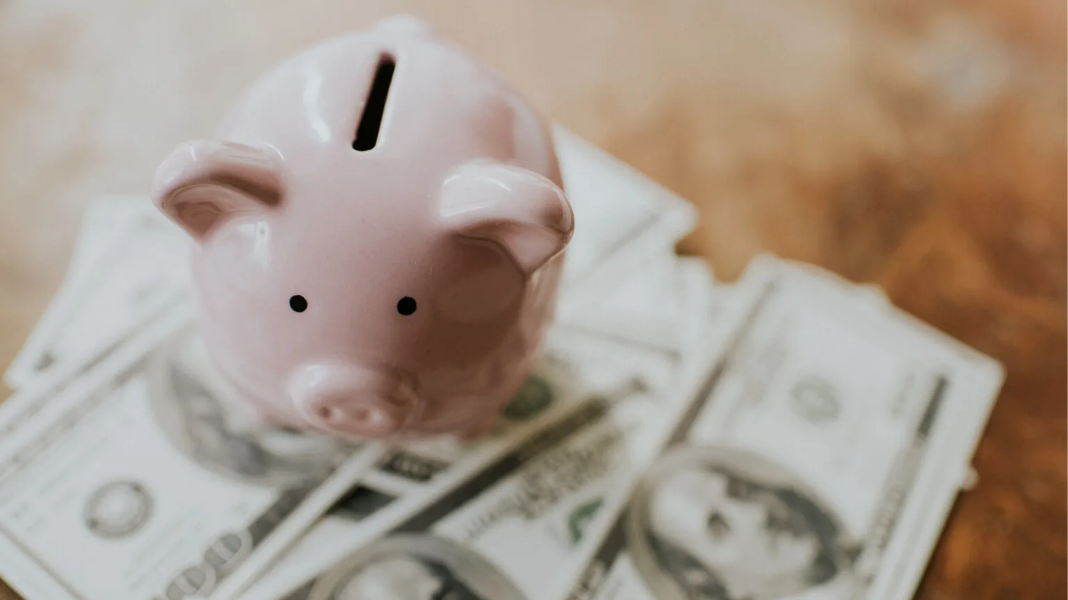 Image: Getty Images piggy bank on cash