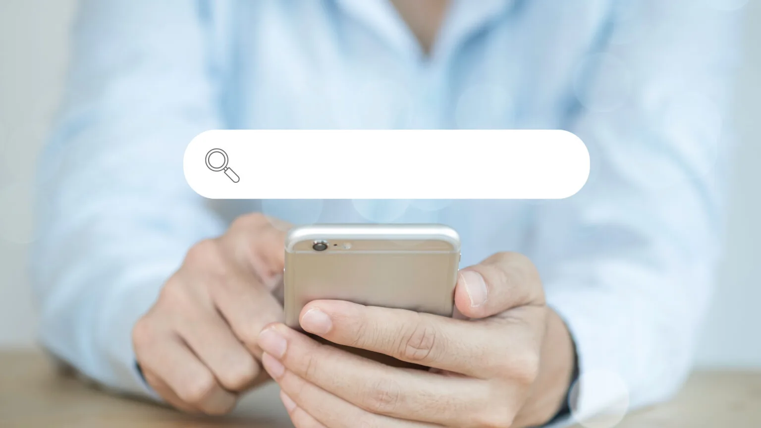 Image: Getty Images person holding a phone searching
