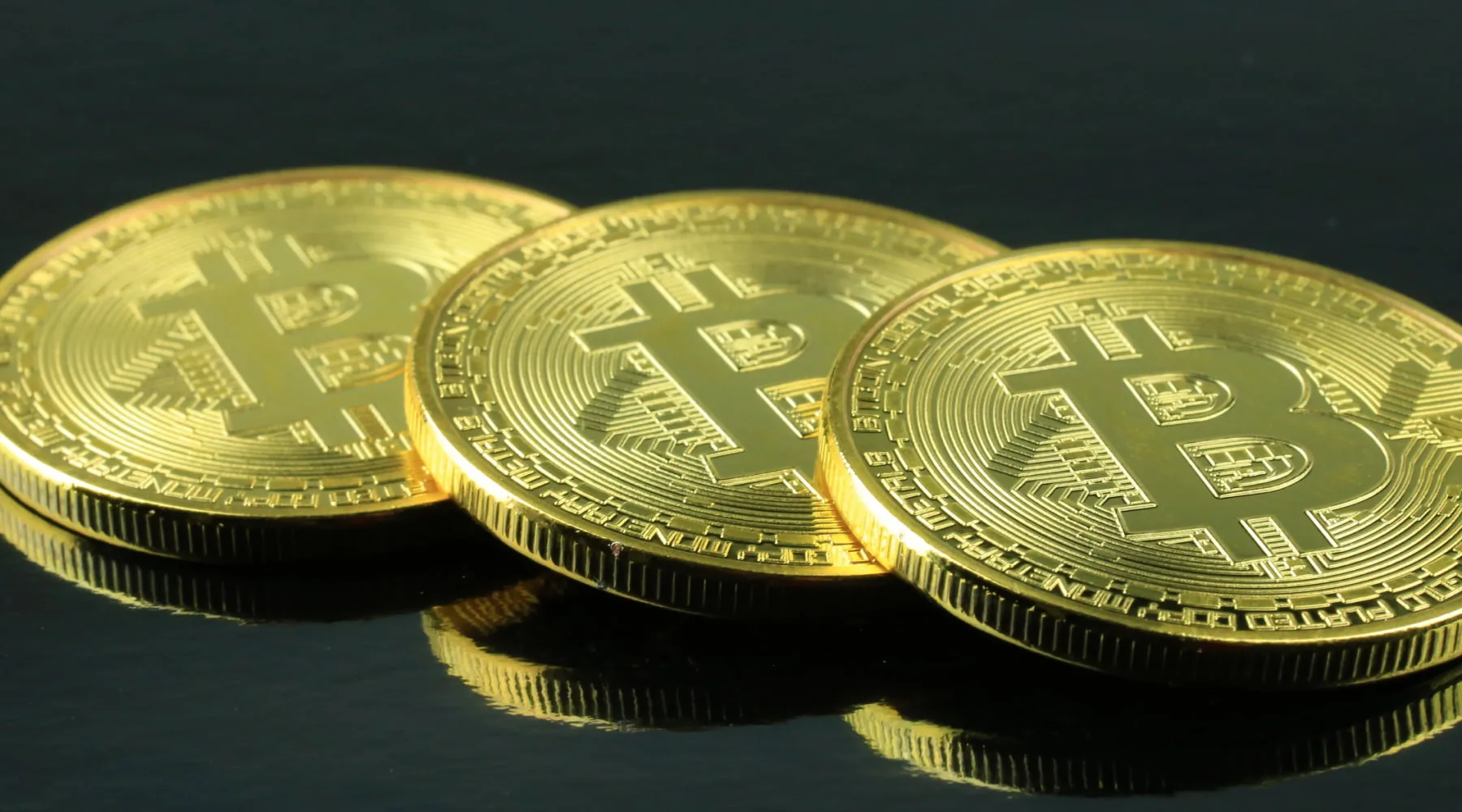 BitCoinsLogosOnCoins_GettyImages_1800x1000 BitCoinsLogosOnCoins_GettyImages_1800x1000