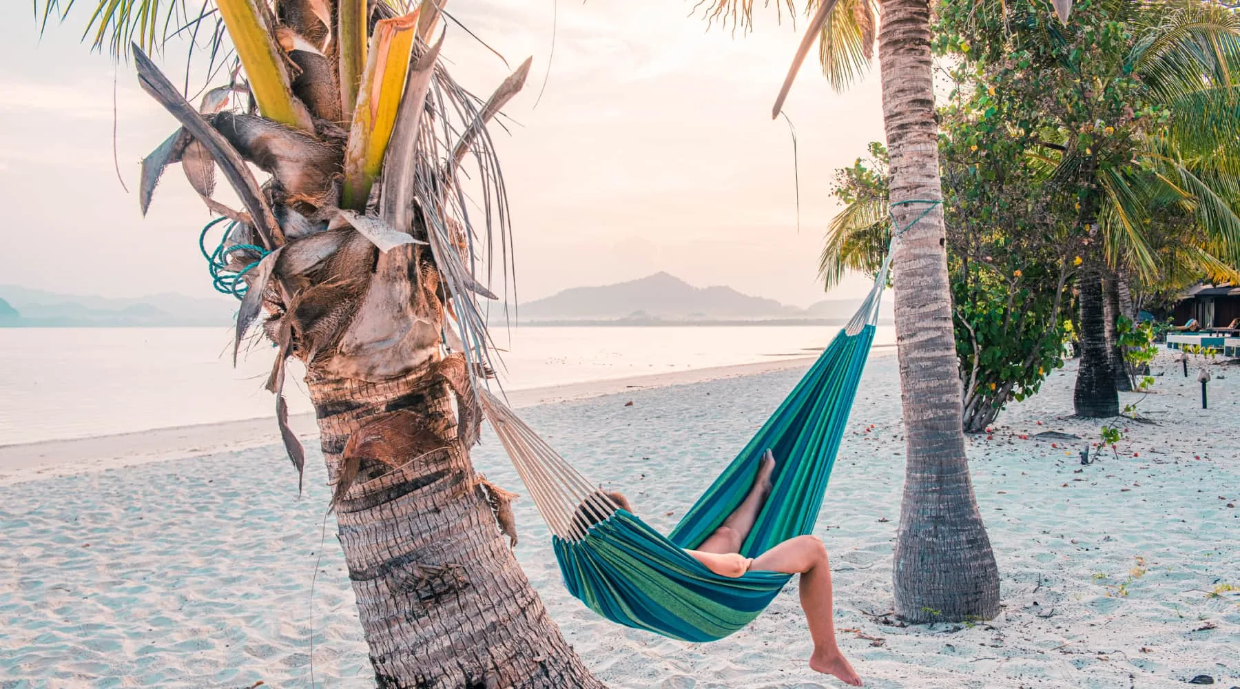 LyingOnHammockOnBeach_GettyImages_1800x1000 LyingOnHammockOnBeach_GettyImages_1800x1000