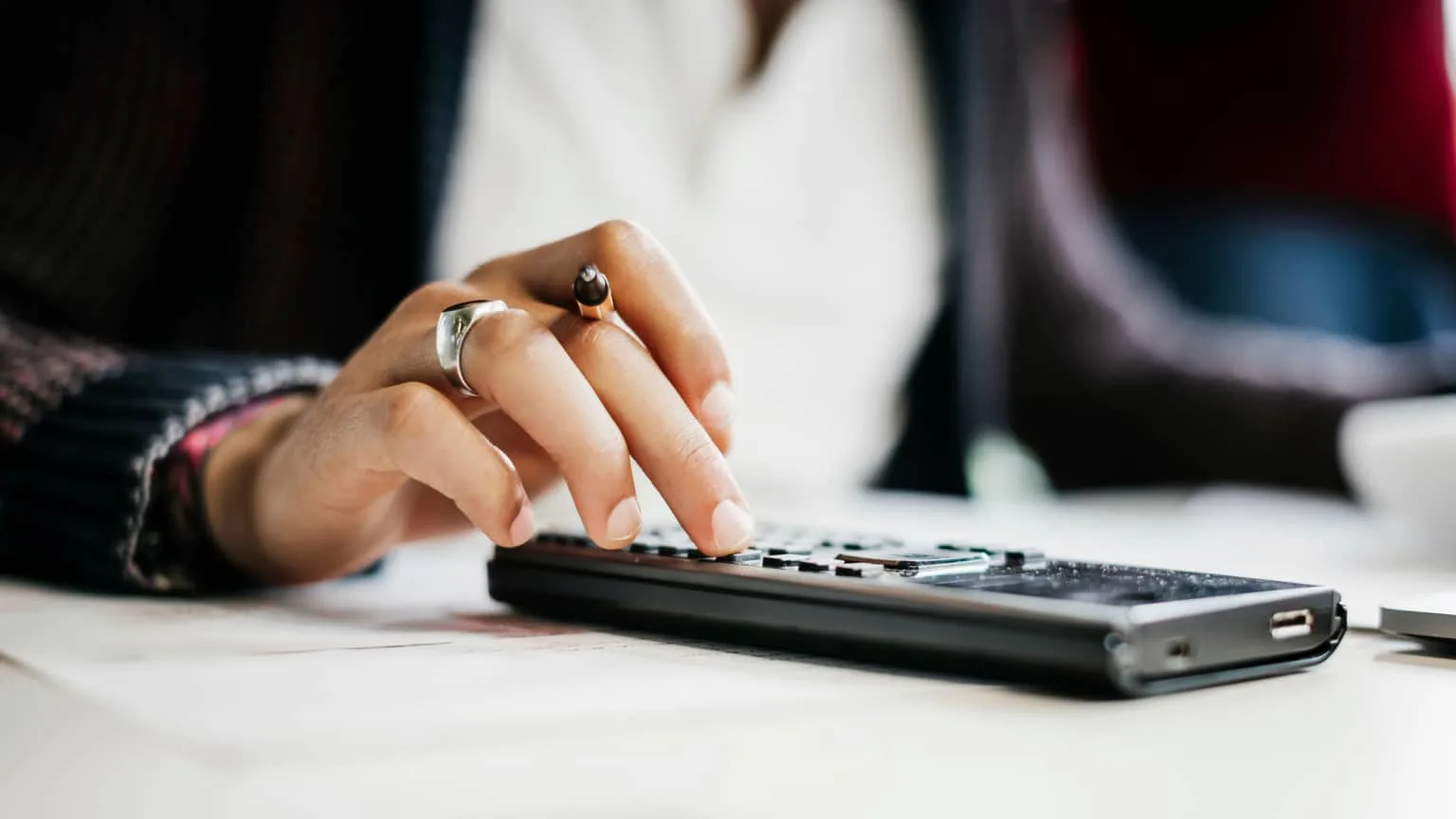 Image: Getty Images a person using a calculator