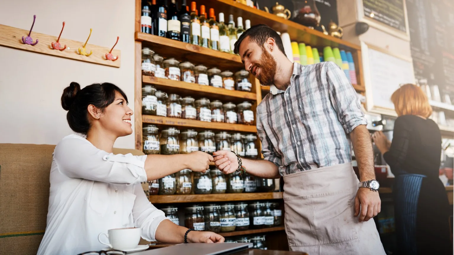Image: Getty Images Woman pays with credit card