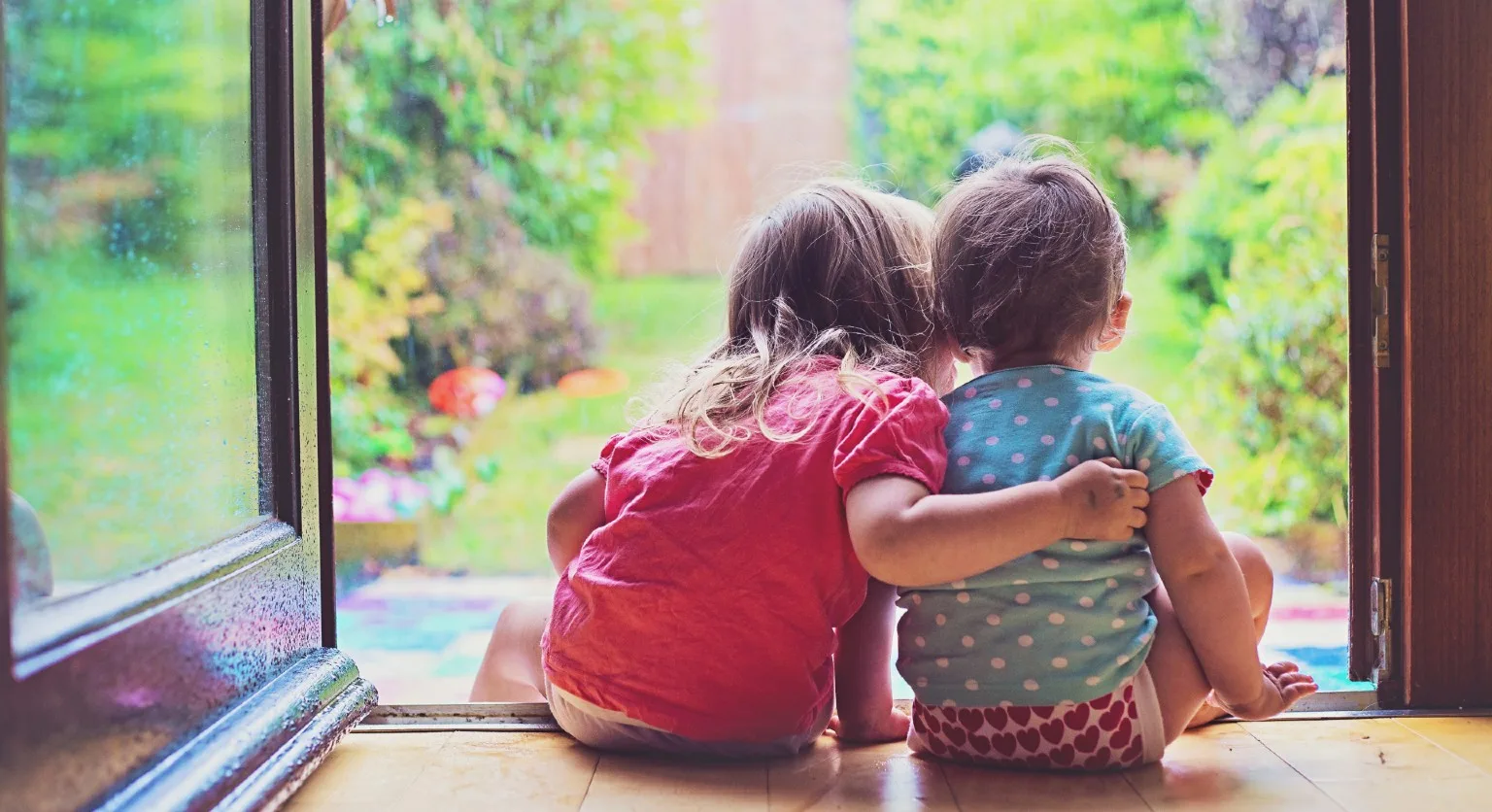 Image: Getty Images Young children play in the garden.