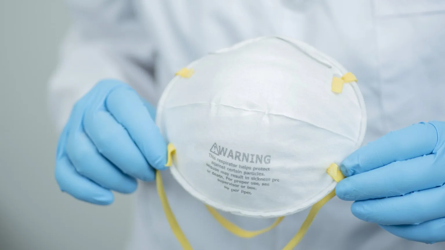 Image: Getty Images View of hands holding pm 2.5 face protection mask and ready to ware