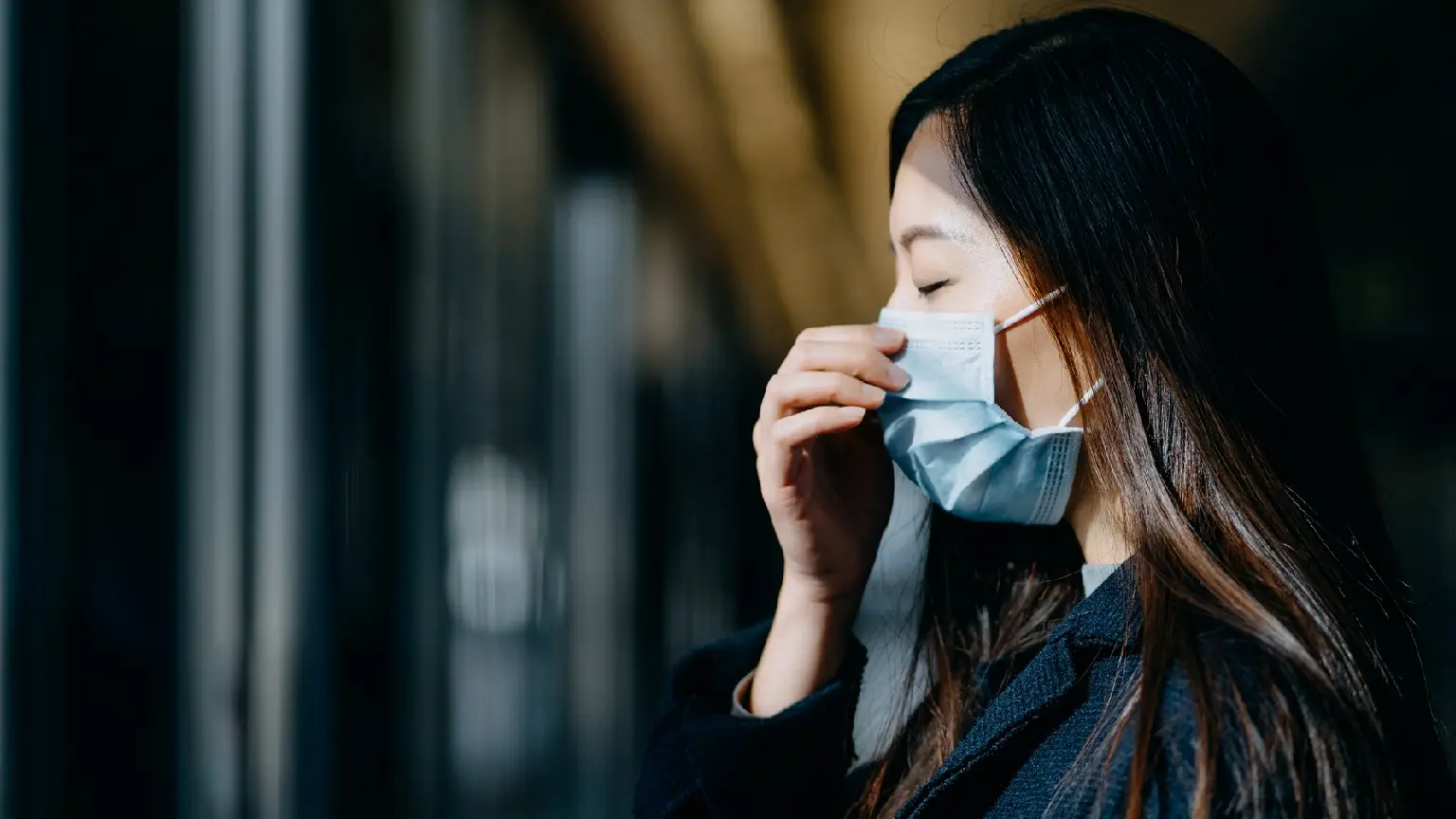 Image: Getty Images asian woman wearing face mask