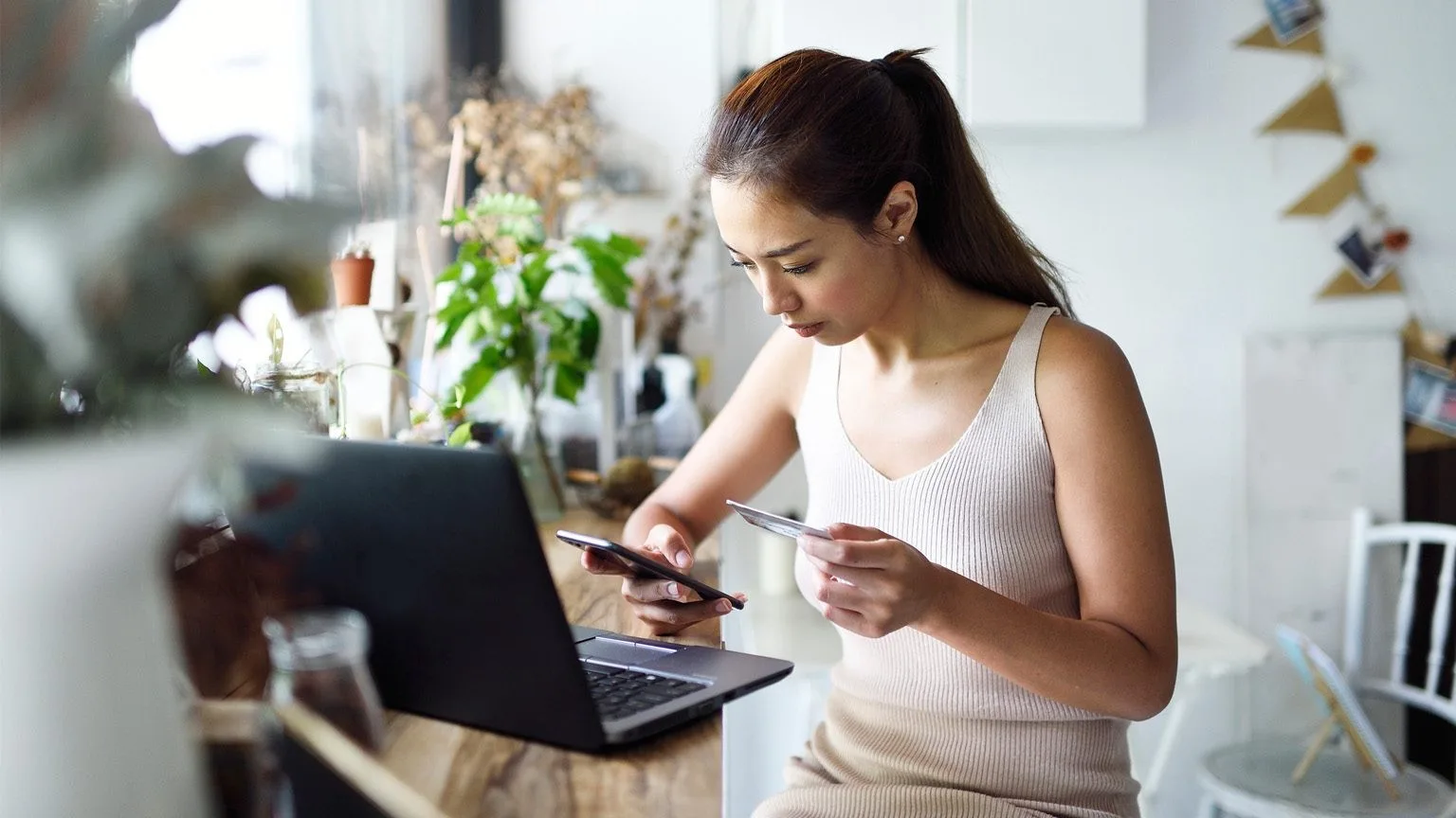 Image: Getty Images Girl Debit Card With Laptop
