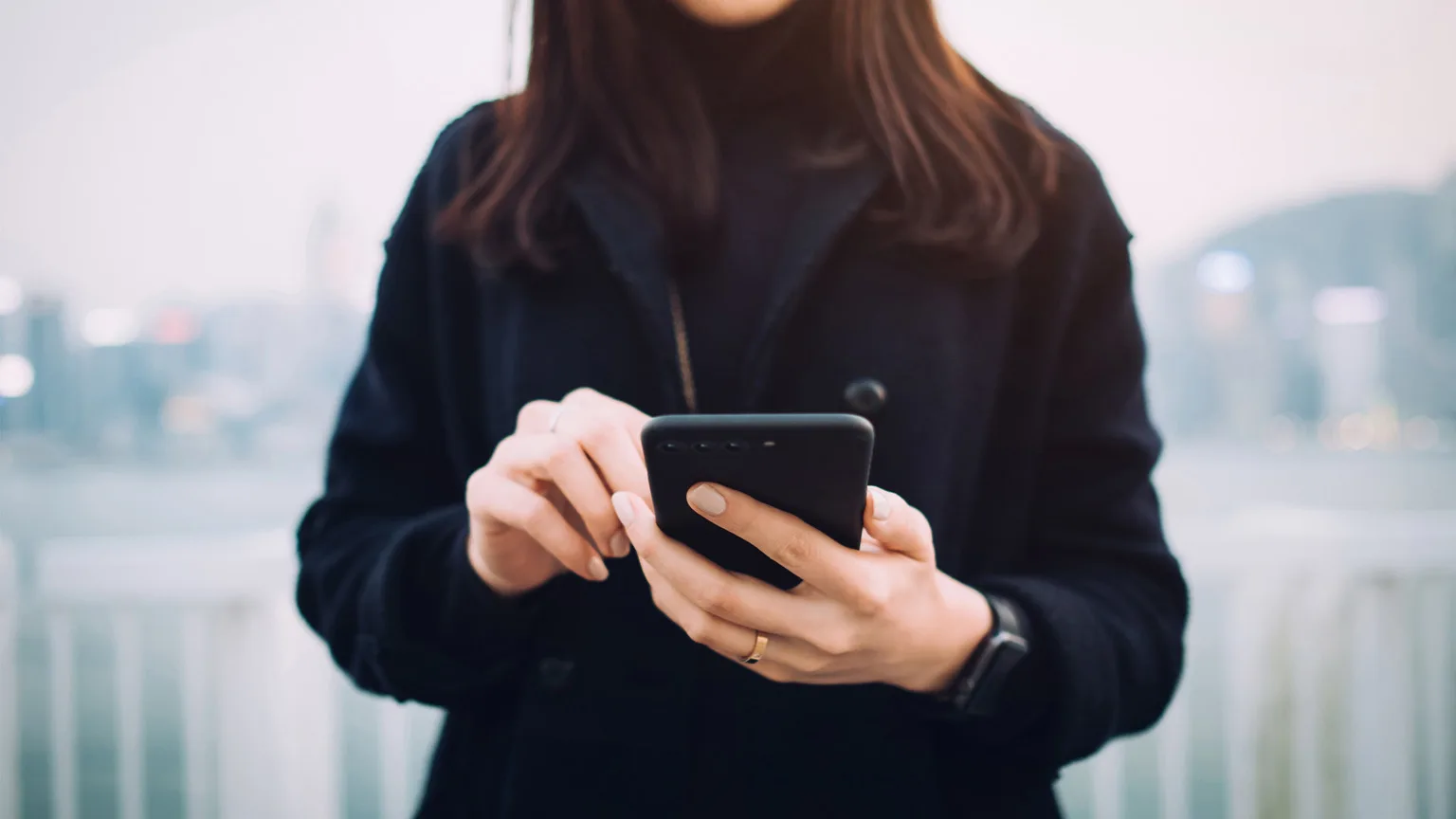 Image: Getty Images Woman managing finances on mobile