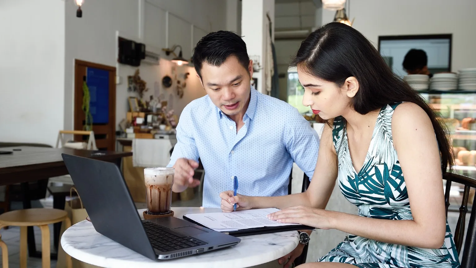 Man and Woman staring at laptop