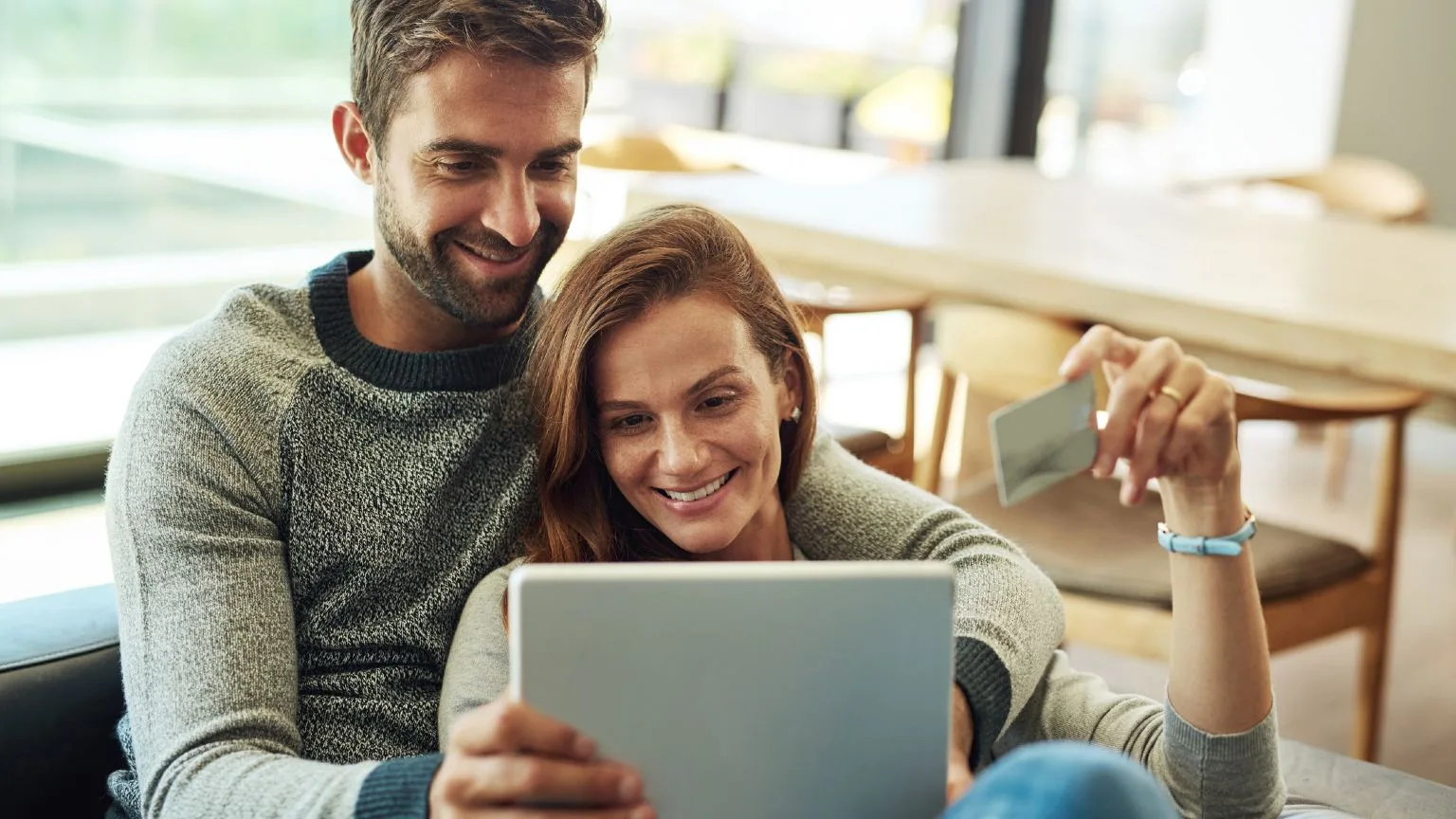 Image: Getty Images Couple Bank Card