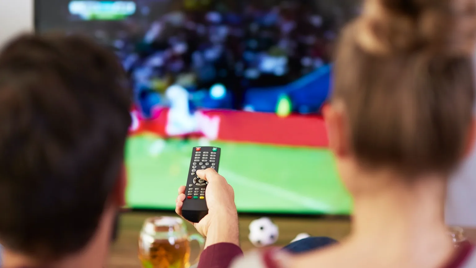 Couple watching sports on TV