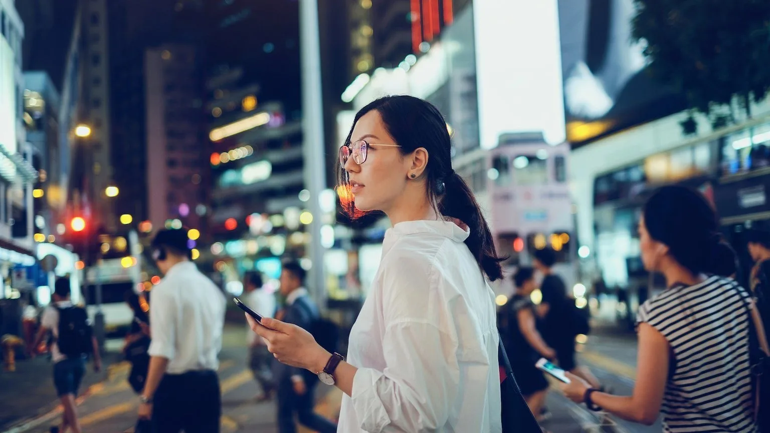 Image: Getty Images Woman holding phone