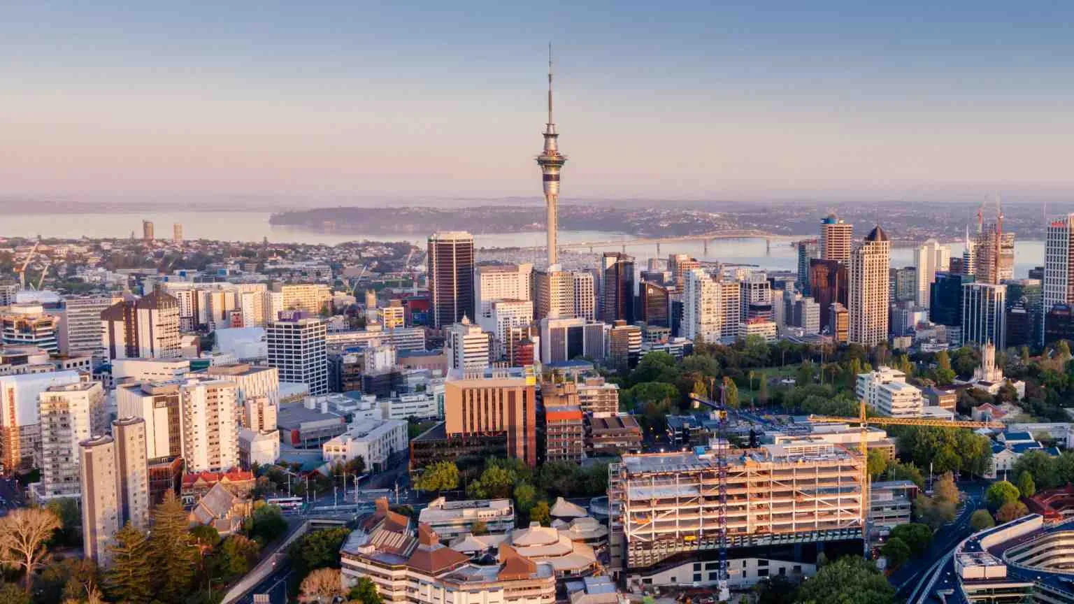 Image: Getty Images 19 OCTOBER, AUCKLAND, NEW ZEALAND. Aerial View Of Auckland City Skyline at sunrise