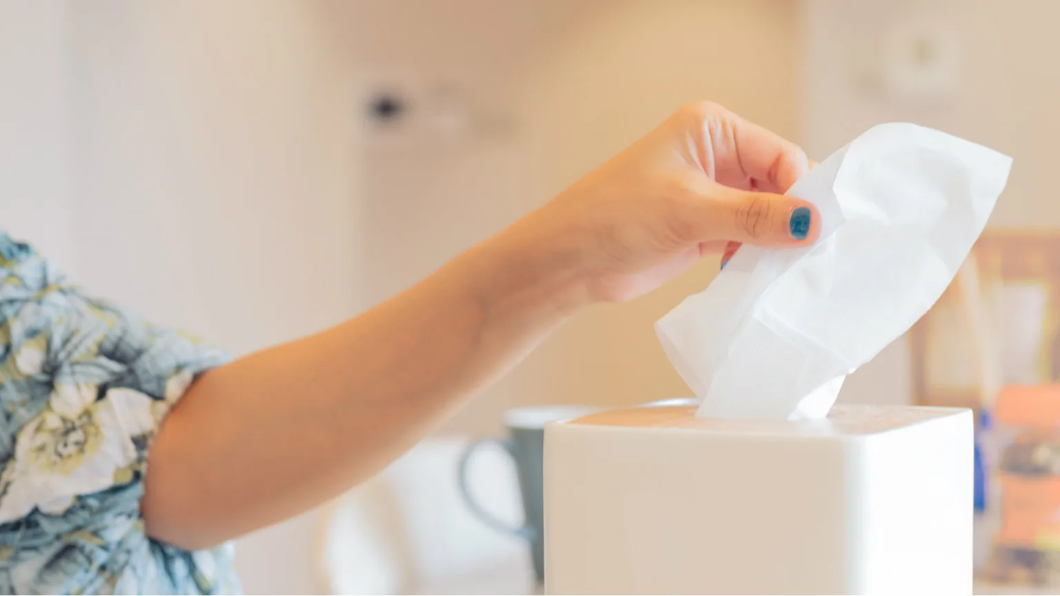 Image: Getty Images Woman holding a tissue