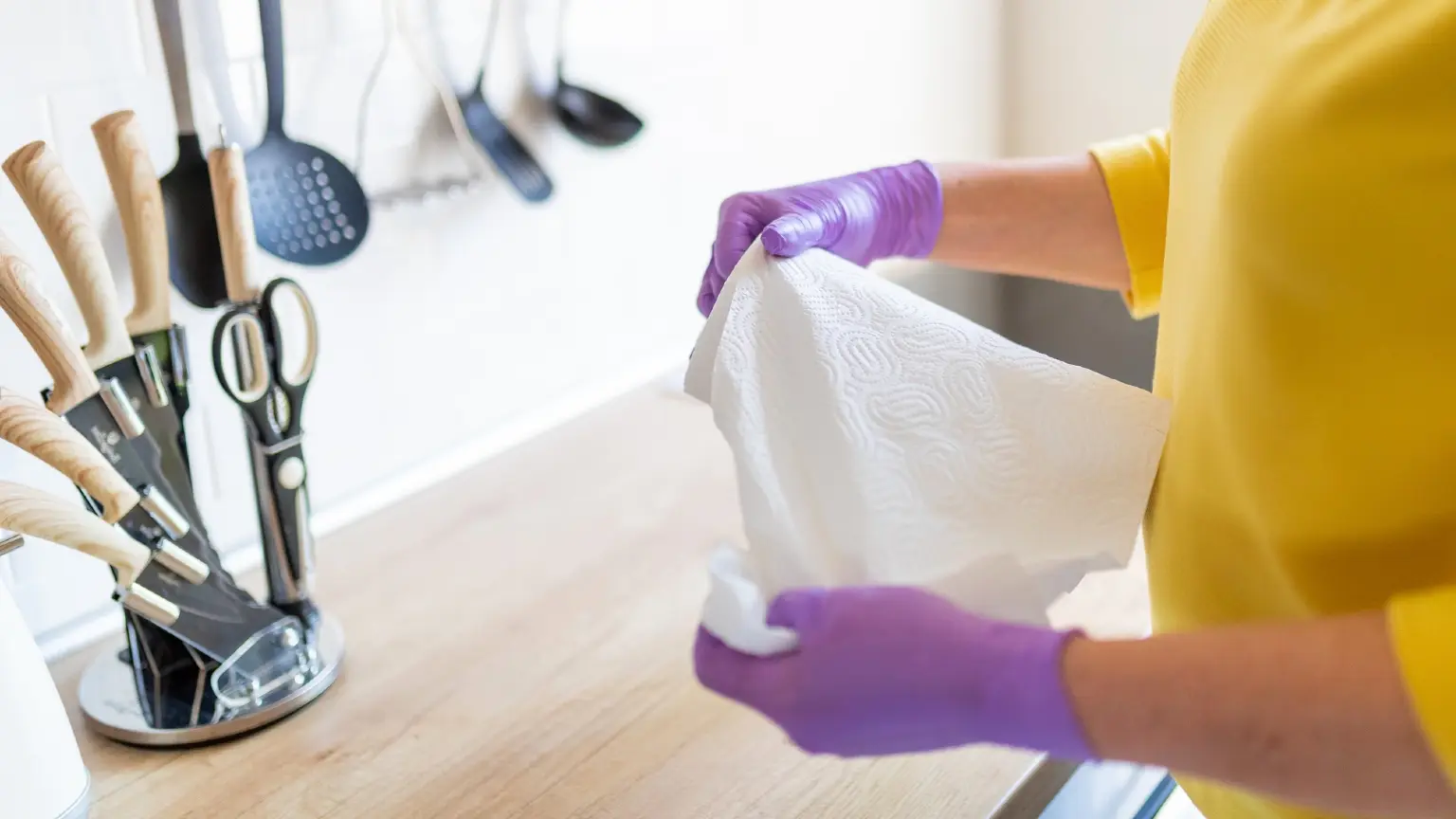 Image: Getty Images woman holding kitchen towel