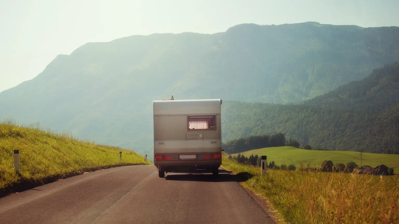 Image: Getty Images Rear view of vintage caravan on the road