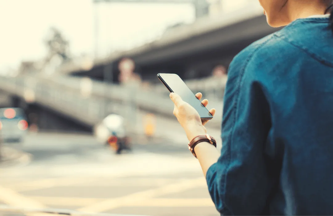 Image: Supplied woman using her phone while walking