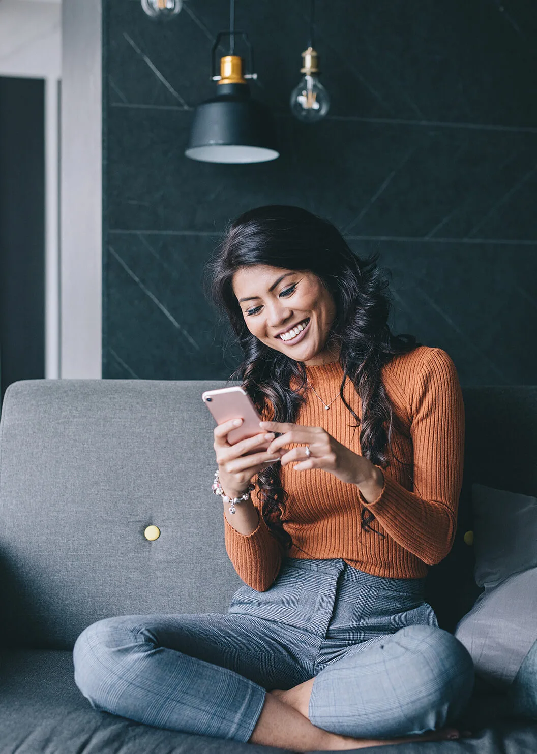 Lady smiling at mobile phone