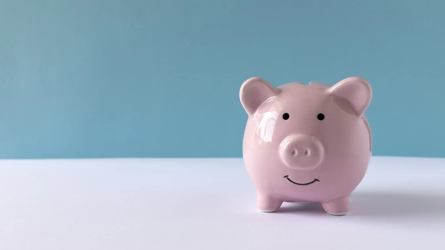 Image: Getty Images Piggy bank on a table