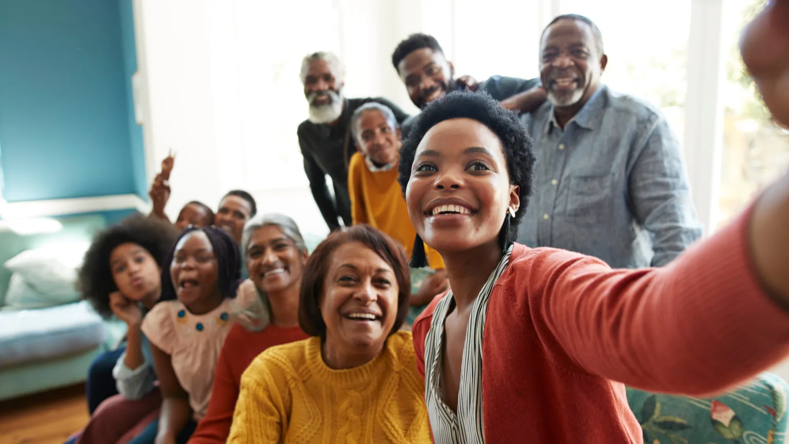 Image: Getty Images Happy, multi-generational family taking a selfie together