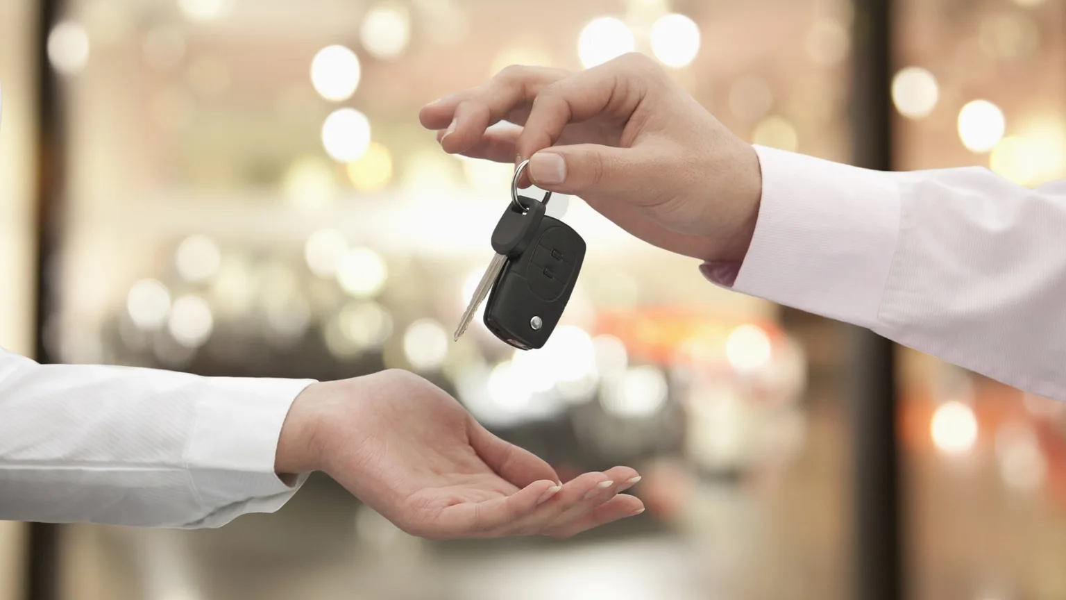 Image: Getty Images Car keys passing between two hands