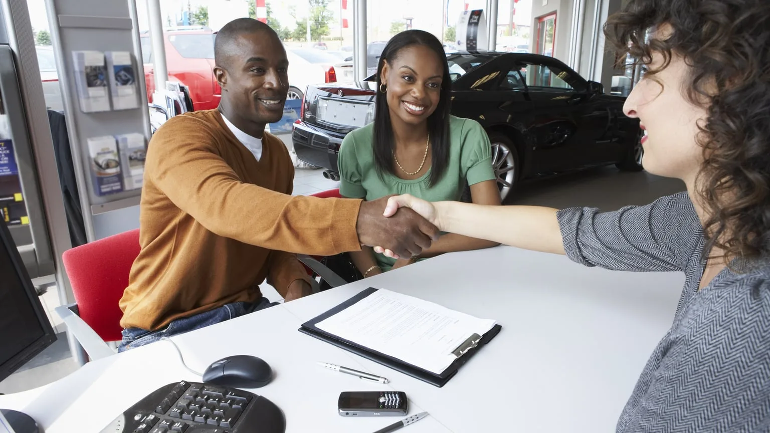 Image: Getty Images Couple buying a used car