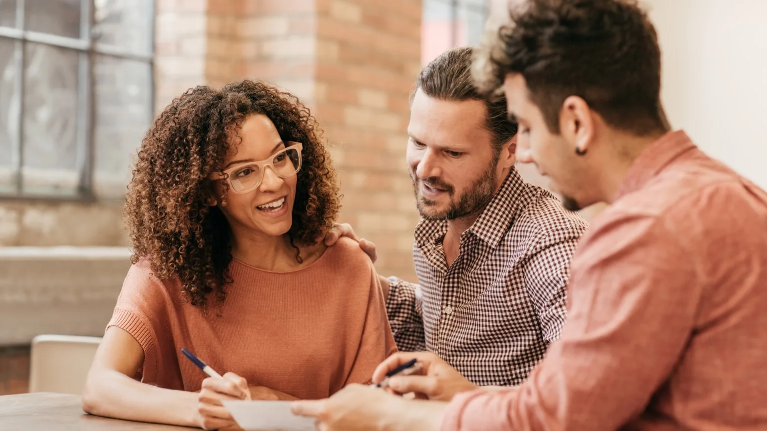 Image: Getty Images Couple meeting with a financial adviser