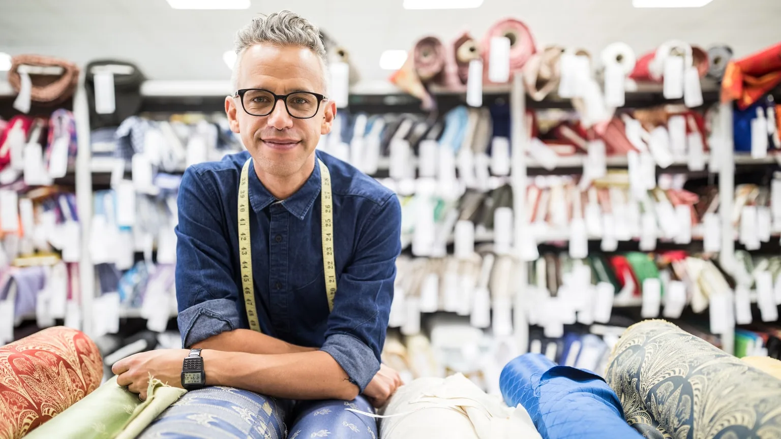 Image: Getty Images Successful male fabric store owner