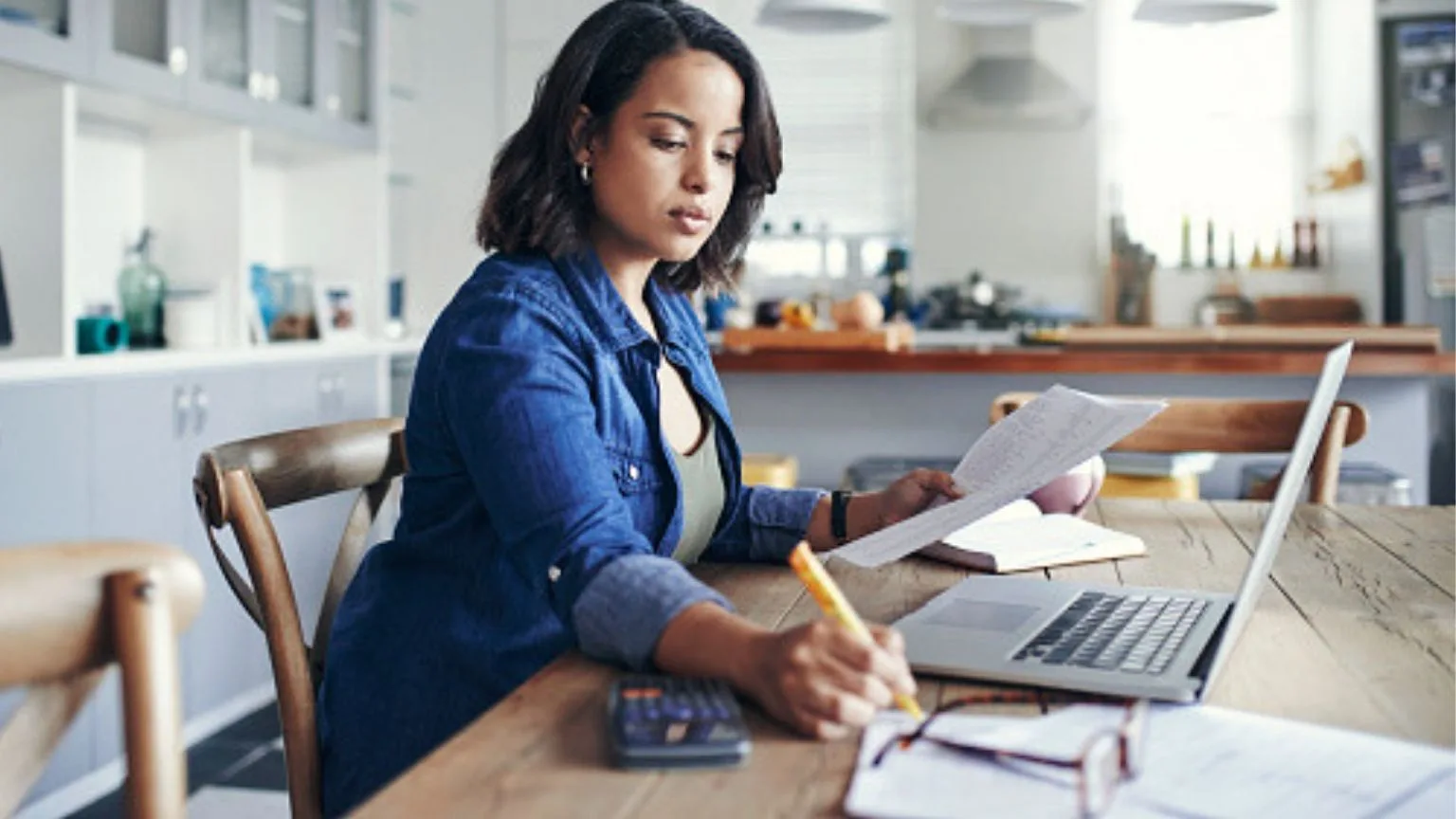Image: Getty Images Women thinking about saving money with a TFSA GIC