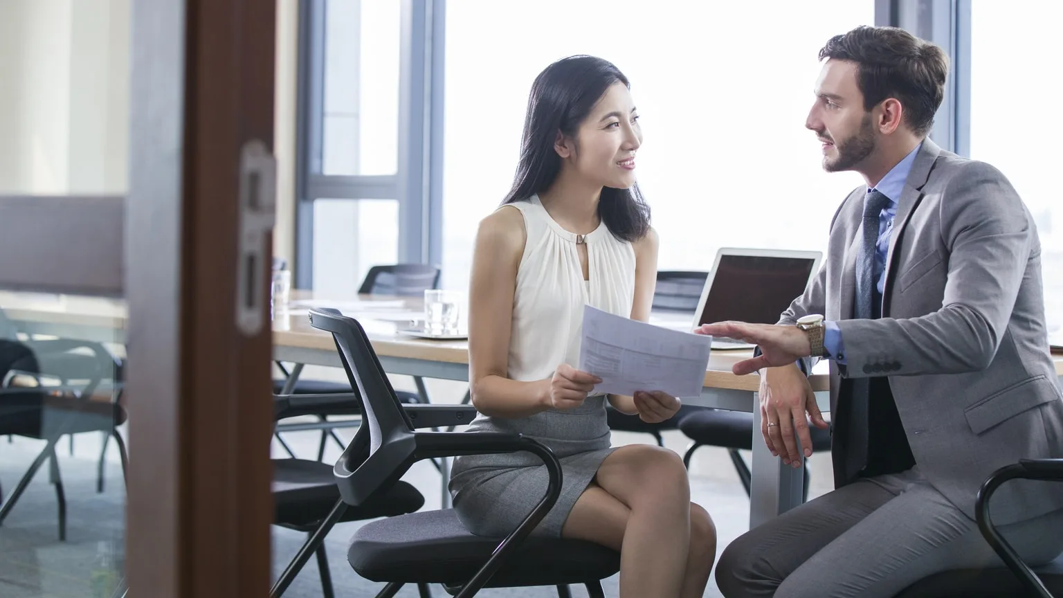 Image: Getty Images Businesswoman and financial advisor discussing financing options
