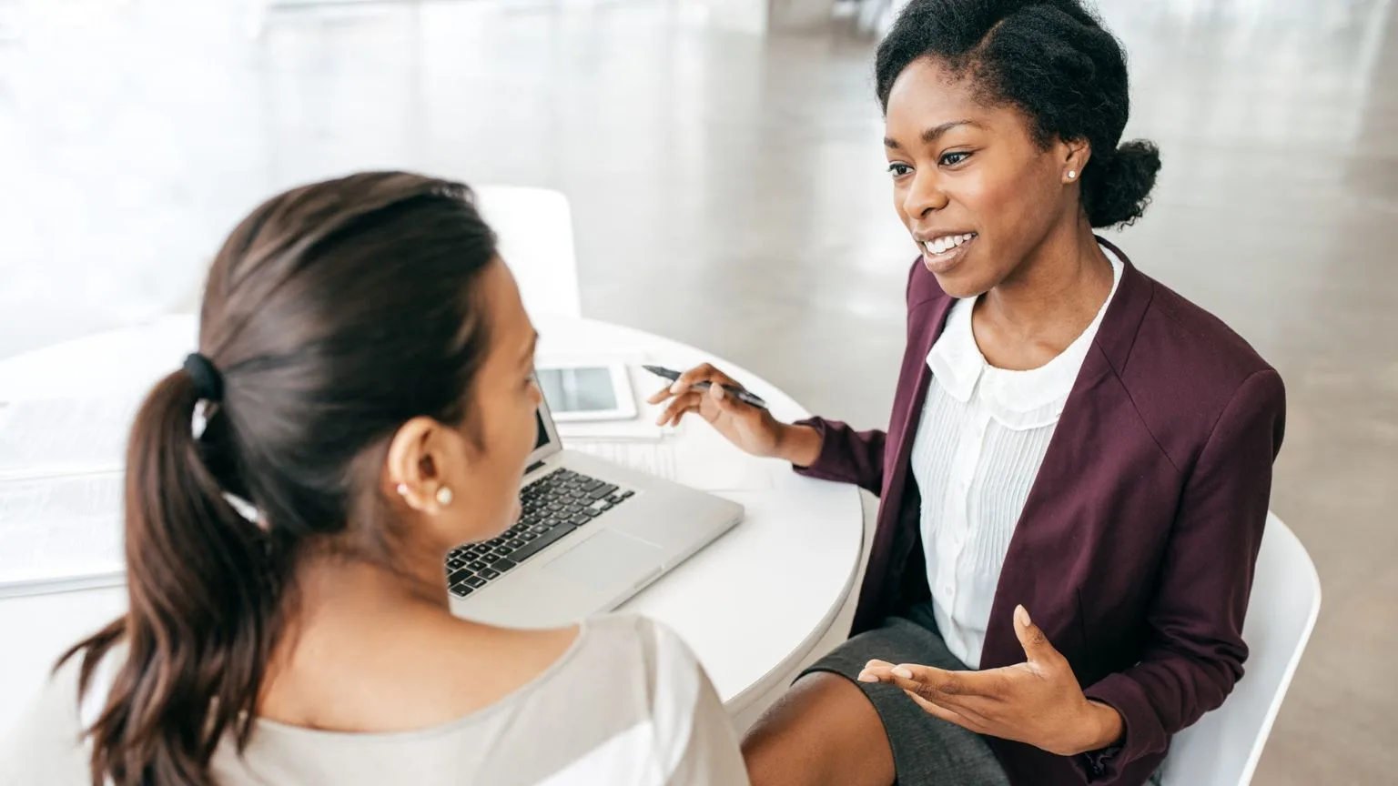 Image: Getty Images A woman compares a GIC vs TFSA