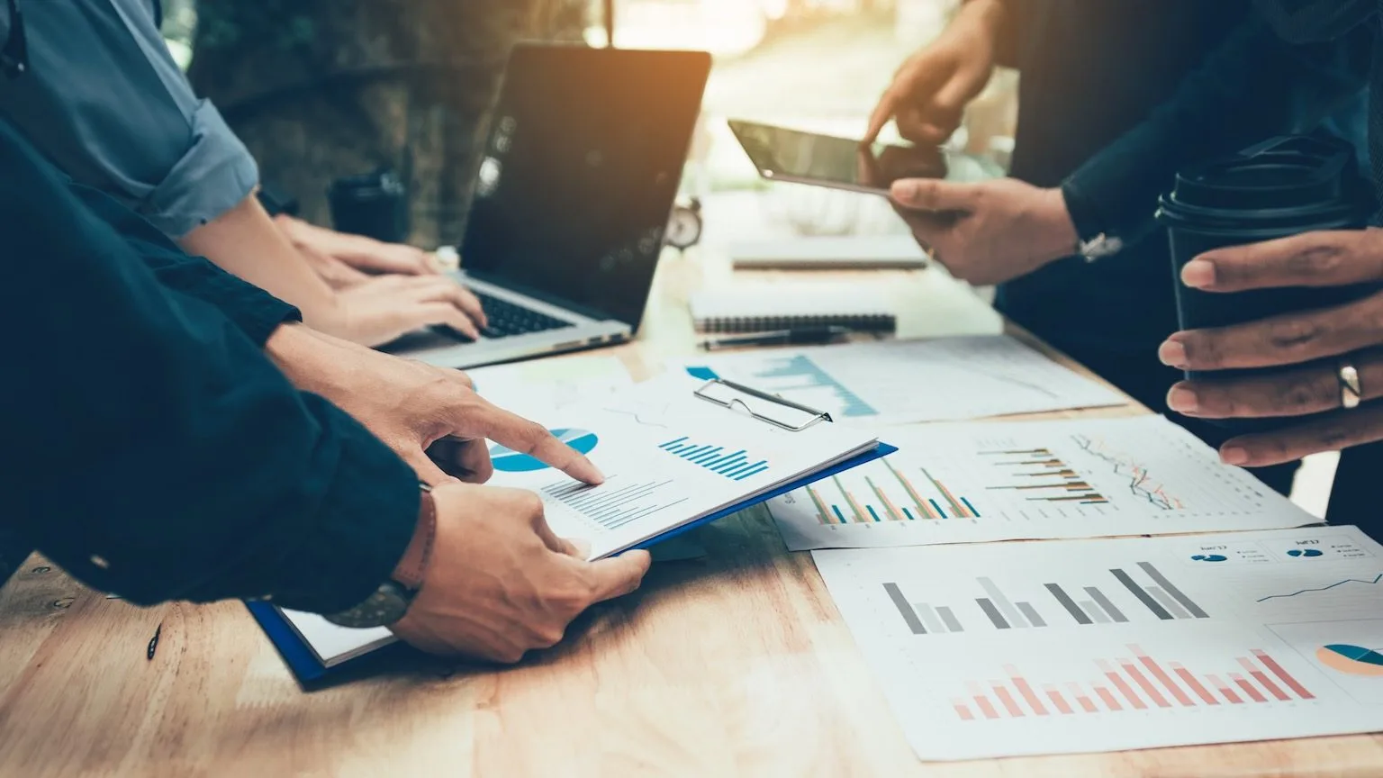 Image: Getty Images Teamwork with business people analysis cost graph on desk at meeting room.