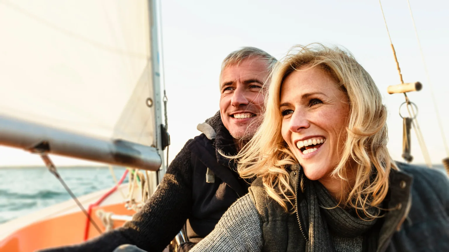 Image: Getty Images An older couple smiling on a sailing boat