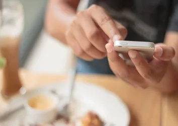 Closeup of someone touching a smartphone