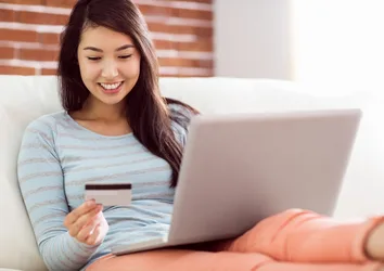 Woman shopping online with credit