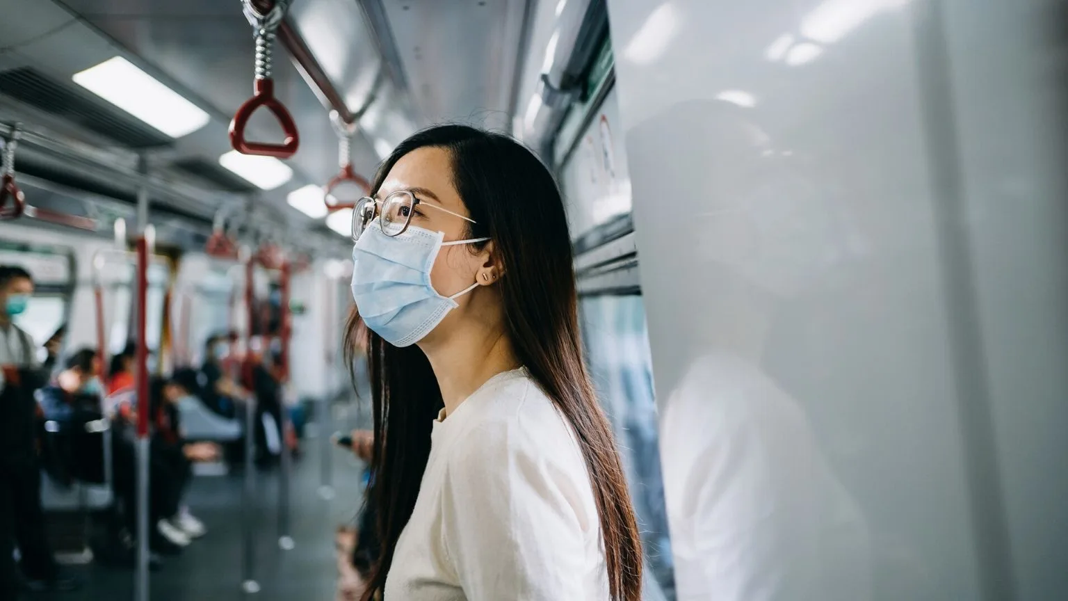Image: Getty Images Girl on the train with mask