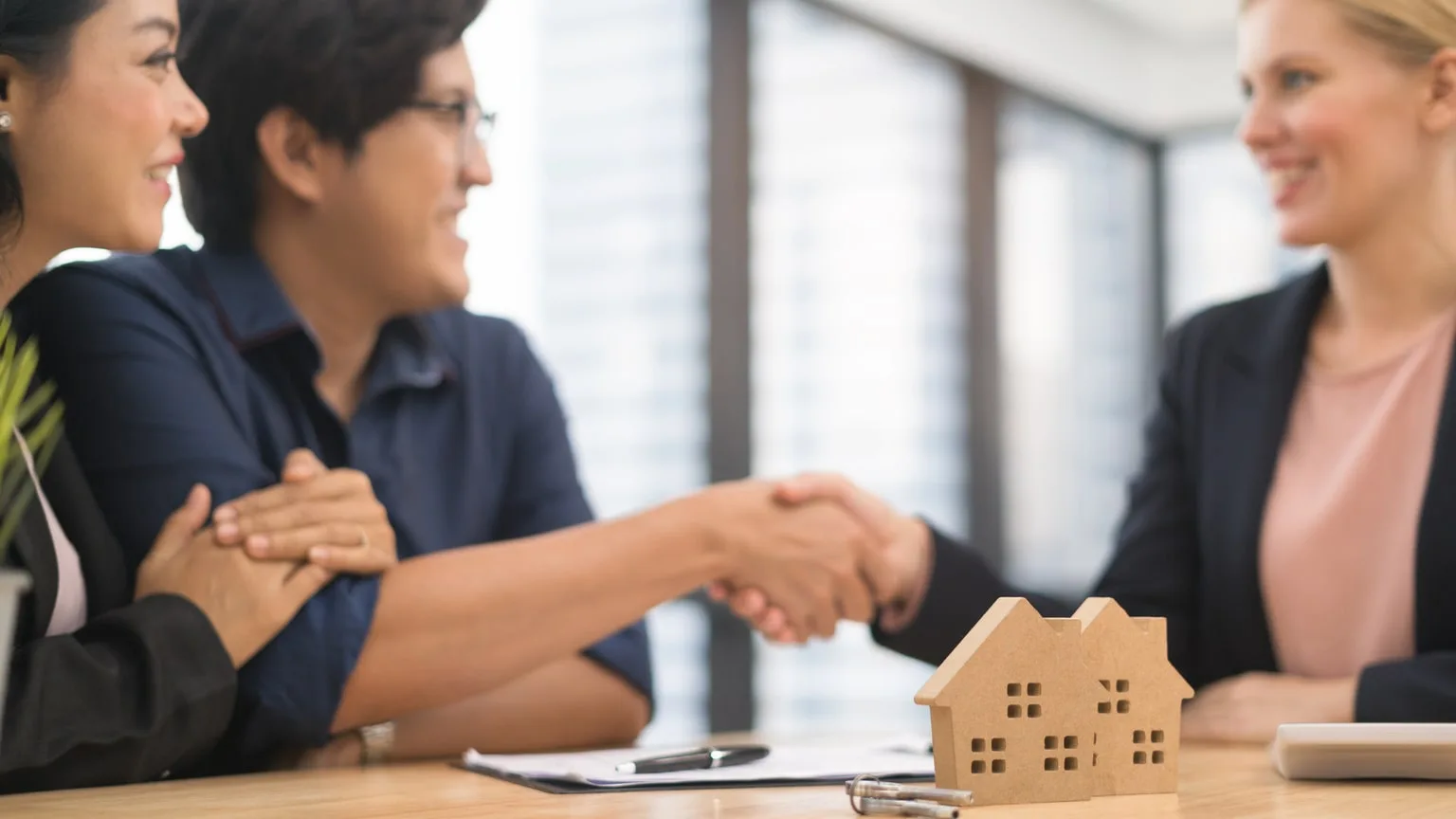 Image: Getty Images Couple and banker agreeing to payment deferral plan