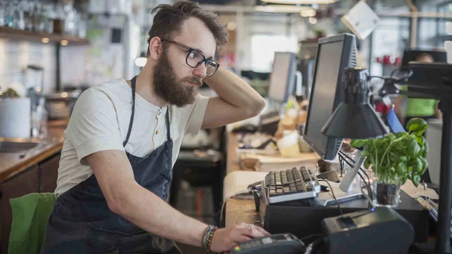 Image: Getty Images Stressed small business owner, cashier