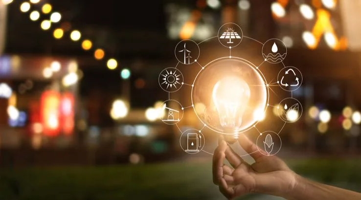 Image: Shutterstock Graphic of person holding light bulb surrounded by different energy symbols