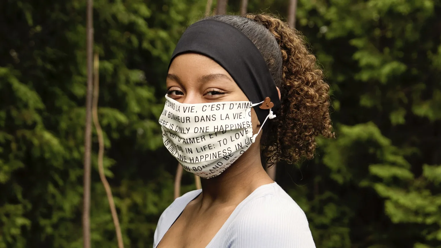 Image: Getty Images Young African woman wearing stylish protective face mask